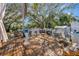 Wide, wooden deck with outdoor seating, a grill, a canopy swing, and an above-ground pool at 4716 Gazania St, New Port Richey, FL 34652