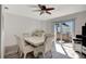 Bright dining room with modern furnishings and sliding glass doors to the outdoor area at 4716 Gazania St, New Port Richey, FL 34652