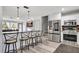 Well-lit kitchen featuring a breakfast bar, stainless steel appliances, and an open layout at 4716 Gazania St, New Port Richey, FL 34652