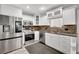 Modern kitchen with stainless steel appliances and ample cabinet space at 4716 Gazania St, New Port Richey, FL 34652