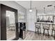 Open kitchen area with countertop seating that faces the living room at 4716 Gazania St, New Port Richey, FL 34652