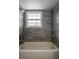 The renovated bathroom boasts new tile and fixtures, blending style with functionality at 5203 Bayshore Blvd # 5, Tampa, FL 33611