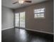 Bedroom featuring dark hardwood floors, sliding glass door, and a double hung window at 5203 Bayshore Blvd # 5, Tampa, FL 33611