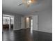 This bedroom features dark wood floors and access to an ensuite area with a kitchenette and bathroom at 5203 Bayshore Blvd # 5, Tampa, FL 33611