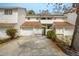 Townhouse exterior showing garages, landscaping, and a driveway at 5203 Bayshore Blvd # 5, Tampa, FL 33611