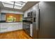 Well-lit kitchen with stainless steel appliances, black countertops, and distressed white cabinets at 5203 Bayshore Blvd # 5, Tampa, FL 33611