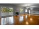 Spacious living room with hardwood floors, a fireplace, and sliding glass doors at 5203 Bayshore Blvd # 5, Tampa, FL 33611