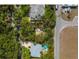 Aerial view of lot surrounded by trees and nearby homes, showcasing the location's proximity to residential areas at 5218 Winding Way, Sarasota, FL 34242