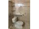 Bright bathroom with shower, safety bars and tile surround at 5971 Terrace Park N Dr # 310, St Petersburg, FL 33709