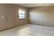 Bedroom with a window and bare concrete floors ready for carpet or flooring at 5971 Terrace Park N Dr # 310, St Petersburg, FL 33709
