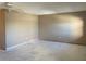Spacious bedroom with a ceiling fan awaiting flooring at 5971 Terrace Park N Dr # 310, St Petersburg, FL 33709