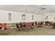 Game room with multiple tables, chairs and traditional decor at 5971 Terrace Park N Dr # 310, St Petersburg, FL 33709
