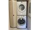 Conveniently located laundry area with a stacked washer and dryer at 5971 Terrace Park N Dr # 310, St Petersburg, FL 33709