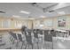 Bright meeting room with tables, chairs, and natural light, ideal for community events and gatherings at 5971 Terrace Park N Dr # 310, St Petersburg, FL 33709