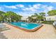 Community swimming pool featuring lounge chairs and well-maintained landscaping, perfect for relaxation and recreation at 5971 Terrace Park N Dr # 310, St Petersburg, FL 33709