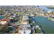 Stunning aerial view showcases waterfront homes with boat docks and the beautiful coastal neighborhood at 750 123Rd Ave, Treasure Island, FL 33706