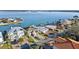 Stunning aerial view showcasing waterfront homes and tranquil waterways, providing a glimpse of luxurious coastal living at 750 123Rd Ave, Treasure Island, FL 33706