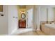 An elegant primary bathroom showcasing a soaking tub, walk-in shower, and vanity with granite countertop at 750 123Rd Ave, Treasure Island, FL 33706