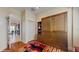 Multi-purpose room showcases a stylish Murphy bed with built-in shelving on hardwood floors at 750 123Rd Ave, Treasure Island, FL 33706