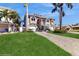 Charming two-story home features a well-kept lawn, grand staircase and a two-car garage at 750 123Rd Ave, Treasure Island, FL 33706