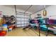 Well-organized garage featuring storage shelves and kayaks, ideal for outdoor enthusiasts with adventure equipment at 750 123Rd Ave, Treasure Island, FL 33706