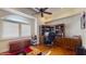 A well-lit home office featuring custom wooden cabinets, a desk, and hardwood flooring at 750 123Rd Ave, Treasure Island, FL 33706