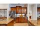Spacious kitchen with stainless steel appliances, granite countertops, and custom wood cabinetry at 750 123Rd Ave, Treasure Island, FL 33706