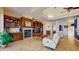 Living room featuring tile floors, built-in cabinets, a fireplace, and recliners at 750 123Rd Ave, Treasure Island, FL 33706