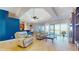 Open-concept living room with a skylight, tile floors, recliners, and water view at 750 123Rd Ave, Treasure Island, FL 33706