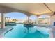 Inviting in-ground pool featuring a center island, view of the waterfront and covered patio at 750 123Rd Ave, Treasure Island, FL 33706