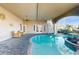 Backyard swimming pool with patio, ceiling fans and staircase to the second level at 750 123Rd Ave, Treasure Island, FL 33706