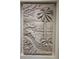 Detailed beach-themed bas relief artwork featuring palm trees, birds, and ocean waves at 750 123Rd Ave, Treasure Island, FL 33706