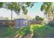 Well maintained backyard with a storage shed and a wood fence at 7990 42Nd N St, Pinellas Park, FL 33781