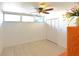 Bedroom with neutral paint, wood-look flooring, and a ceiling fan for additional comfort at 7990 42Nd N St, Pinellas Park, FL 33781