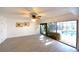 Bright bonus room with ceiling fan, overlooking the pool and patio through sliding glass doors at 7990 42Nd N St, Pinellas Park, FL 33781