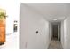Hallway leads to multiple rooms, with a light-colored wood-look flooring at 7990 42Nd N St, Pinellas Park, FL 33781