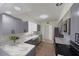 Modern kitchen showcasing gray cabinets, stainless steel appliances, and marble countertops at 7990 42Nd N St, Pinellas Park, FL 33781
