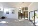 Bright living area with fireplace, hardwood floors, and sliding glass doors to outdoor living at 7990 42Nd N St, Pinellas Park, FL 33781