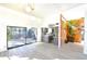 Bright living room with sliding glass doors, gray cabinets, and stone accent wall at 7990 42Nd N St, Pinellas Park, FL 33781