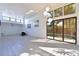 Bright living room featuring a fireplace, modern lighting, and sliding glass doors leading to a pool at 7990 42Nd N St, Pinellas Park, FL 33781