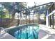 Enclosed pool with mature landscaping and serene views at 7990 42Nd N St, Pinellas Park, FL 33781