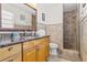 Bright bathroom with granite countertop vanity, tiled shower, and ample storage at 8517 43Rd W Ave, Bradenton, FL 34209