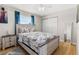 Cozy bedroom features light wood floors, a light wood frame bed, and a closet at 8517 43Rd W Ave, Bradenton, FL 34209