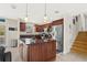 Spacious kitchen with wooden cabinets, granite counters, stainless steel appliances and large island at 8517 43Rd W Ave, Bradenton, FL 34209