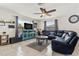 Comfortable living room with ample seating, ceiling fan, and adjacent kitchen area at 8517 43Rd W Ave, Bradenton, FL 34209