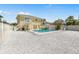 Backyard area with swimming pool, lounging area, privacy fence, and lots of space at 8517 43Rd W Ave, Bradenton, FL 34209