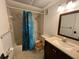 Clean bathroom featuring a shower-tub combo, and neutral colored single sink vanity at 8550 Shadblow Ct # 2, Port Richey, FL 34668
