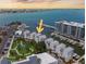 Stunning aerial view of waterfront condos, featuring a marina, and city skyline at 870 N Osceola Ave, Clearwater, FL 33755