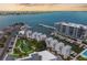 Panoramic aerial view of waterfront community with boat docks, city skyline, and serene bay at 870 N Osceola Ave, Clearwater, FL 33755