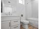 Bathroom features a toilet, vanity with white cabinets and a tub/shower combo at 870 N Osceola Ave, Clearwater, FL 33755